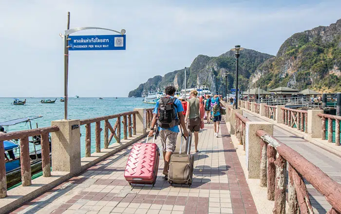 Travelers walking towards the ferry at Tonsai Port, Ko Phi Phi Don